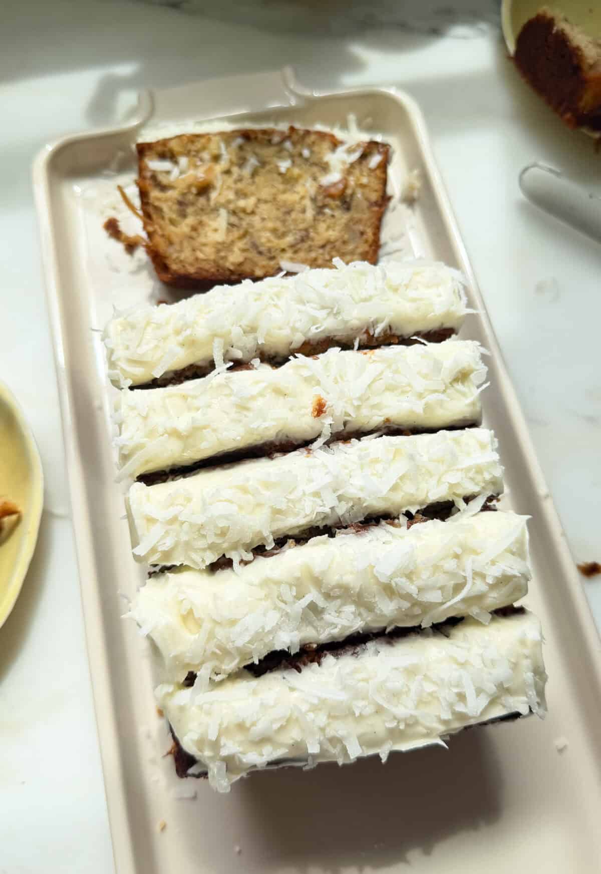 Tropical Banana Bread sliced on plate.