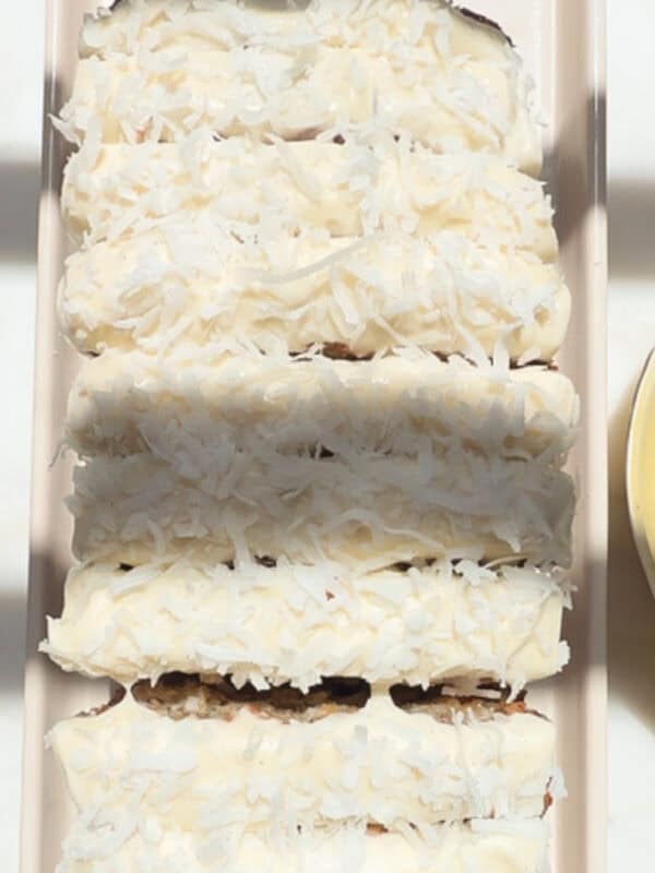 Tropical Banana Bread sliced on a plate.