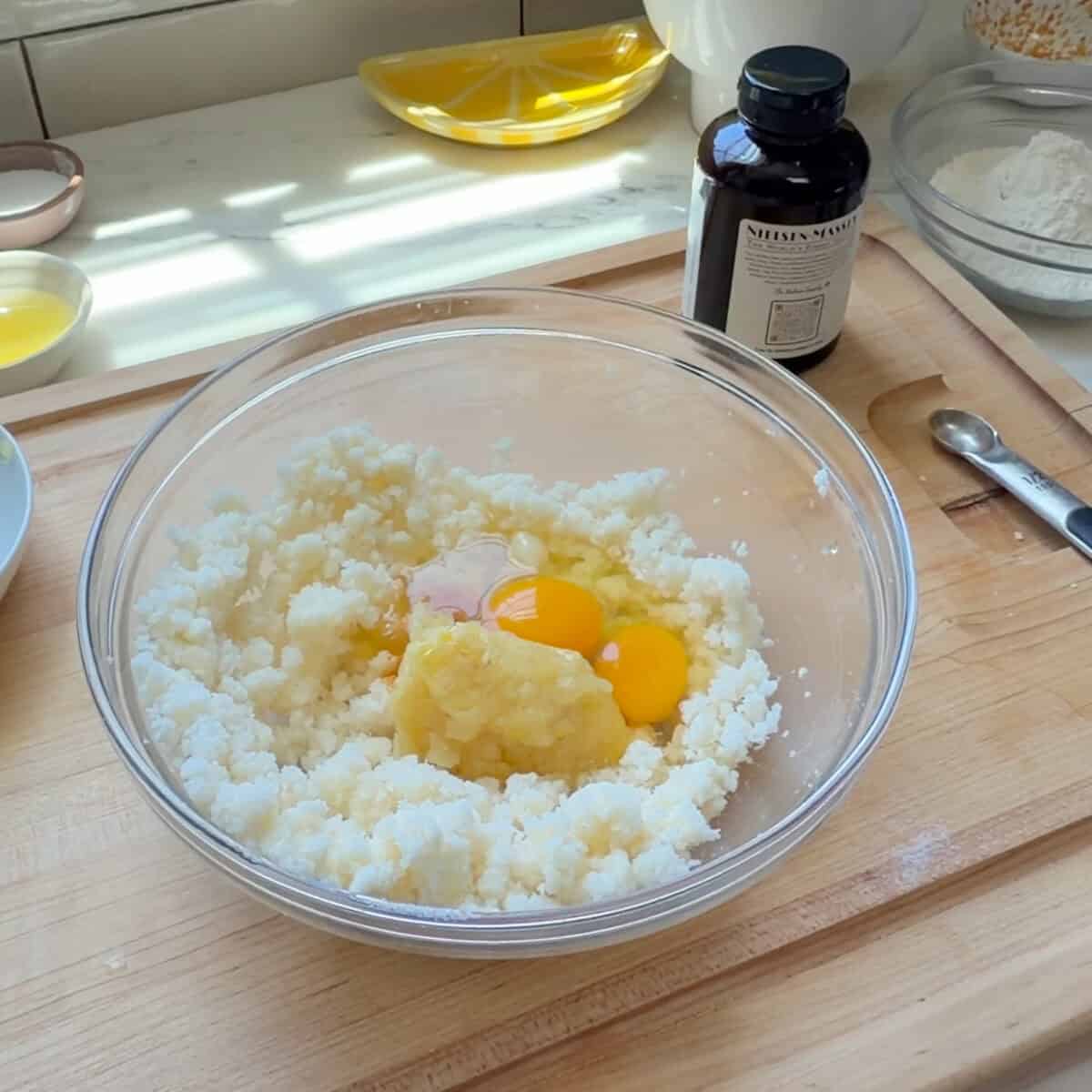 Butter sugar mixture with eggs in a bowl.