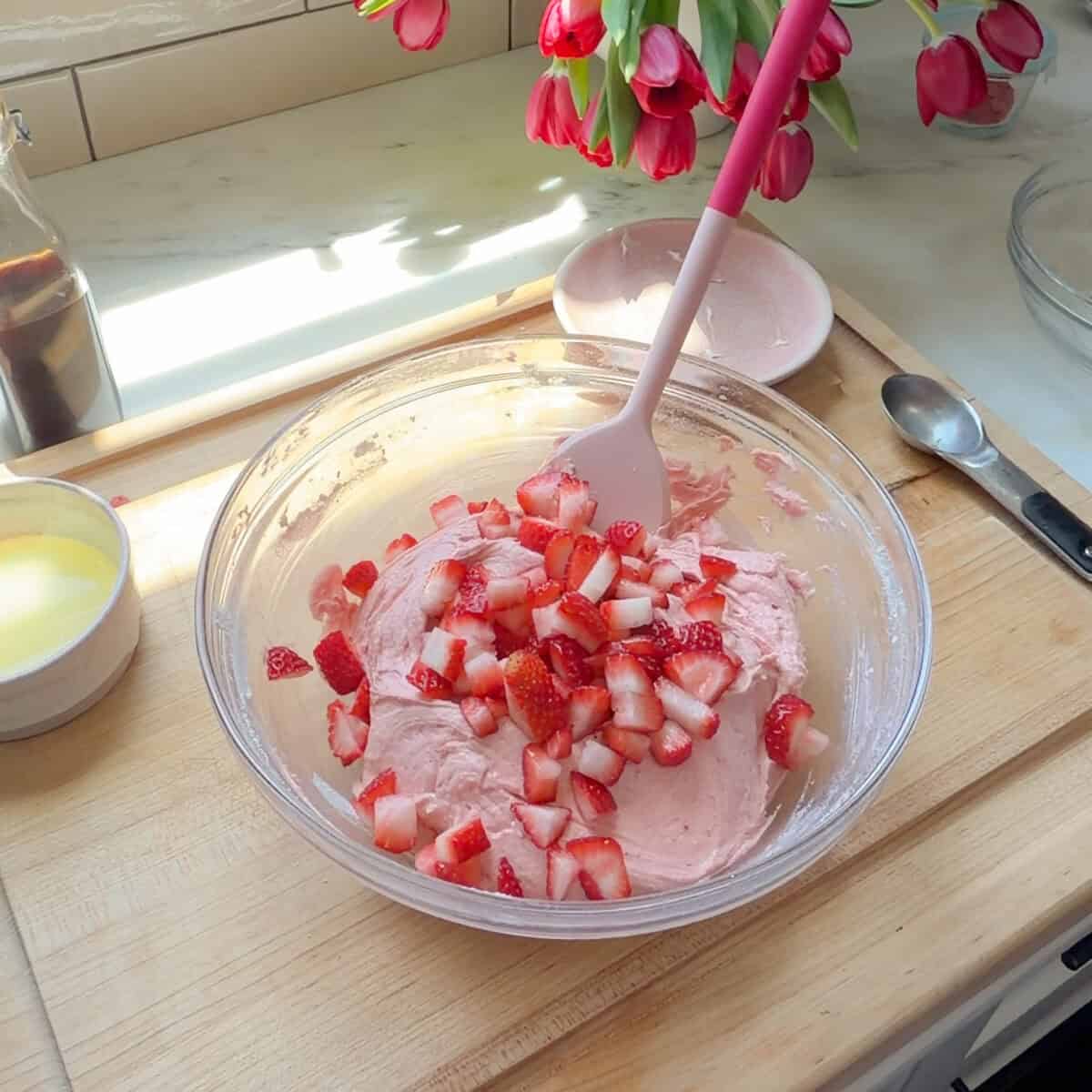 Strawberry Brownie batter with fresh strawberries added.