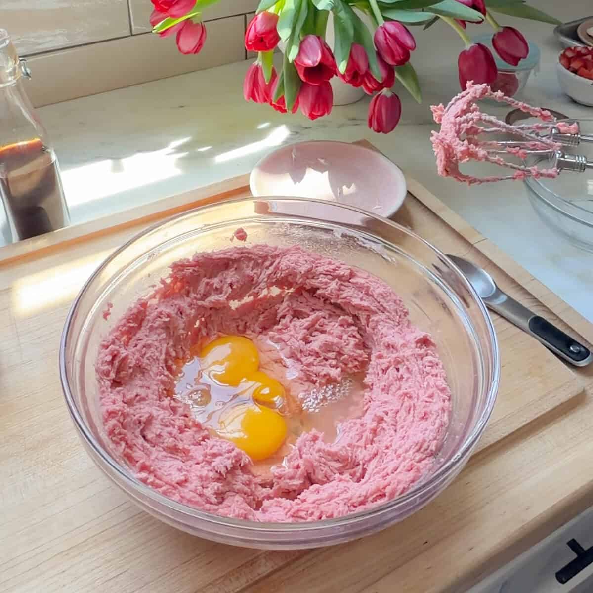Eggs on top of fluffy butter and sugar mixture.