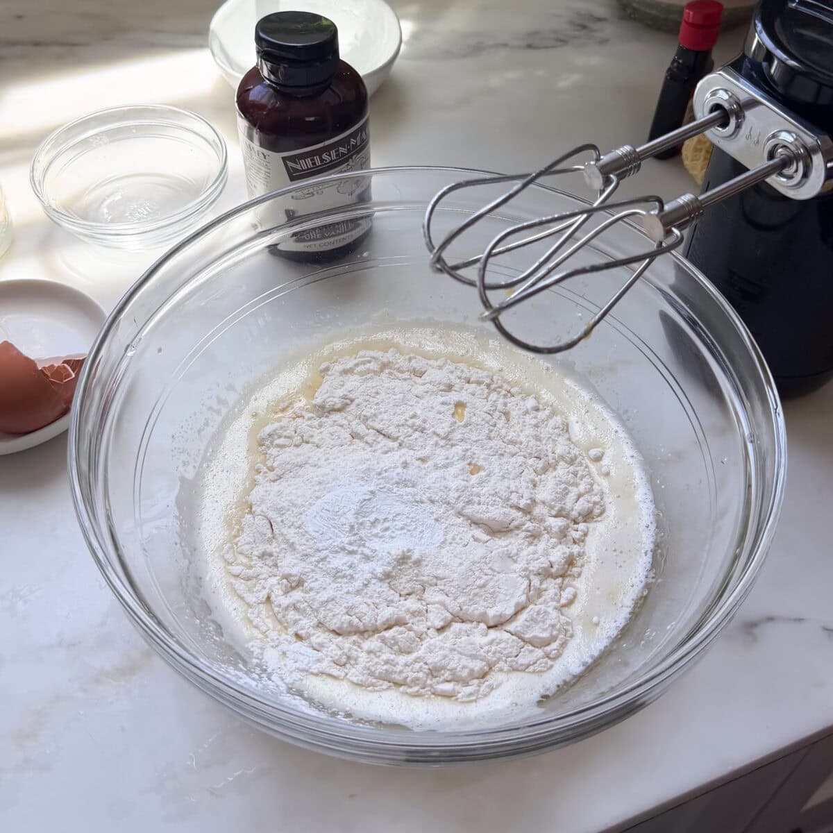 Dry ingredients added to cake batter.