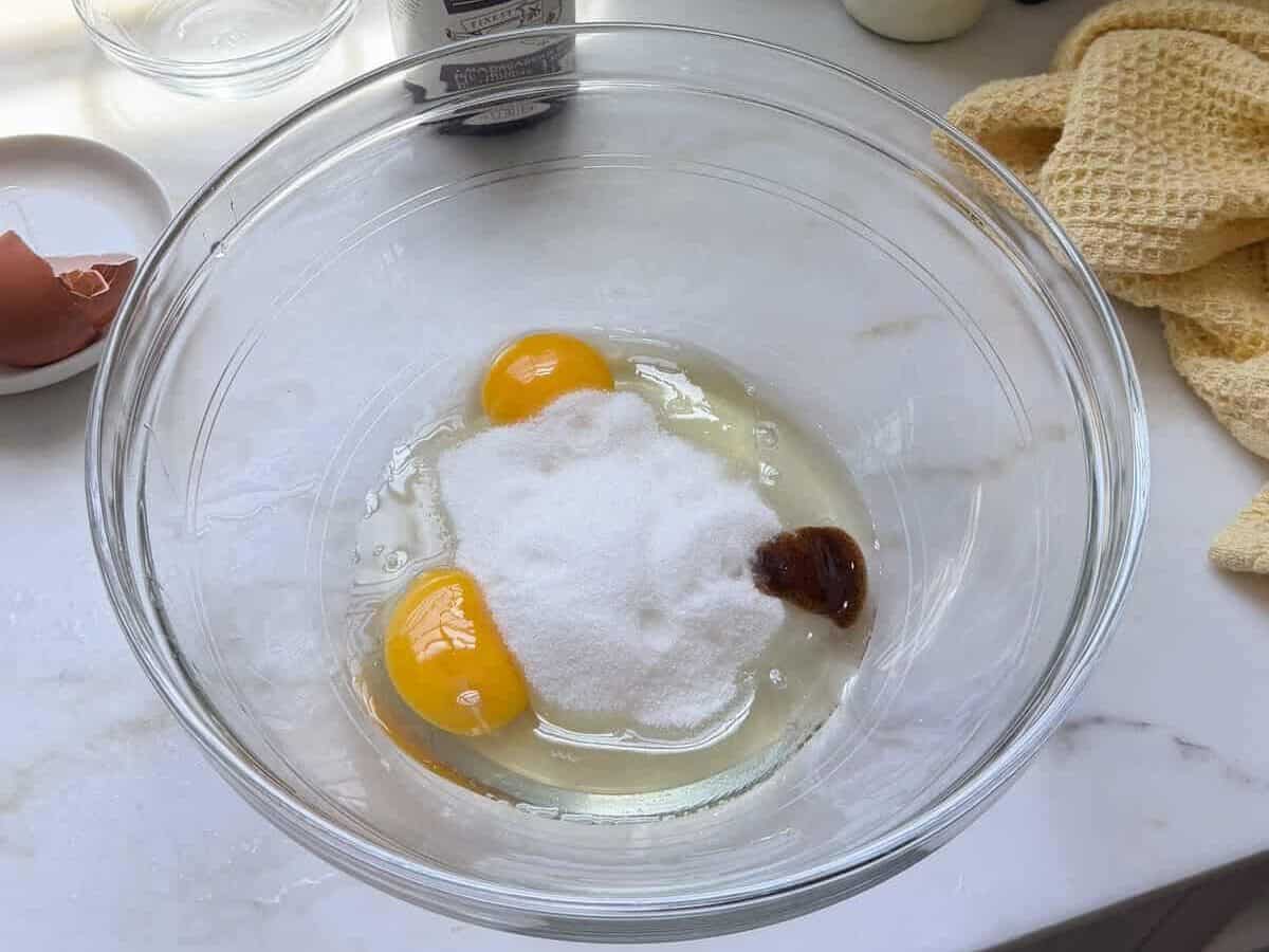 Eggs, sugar, and vanilla in a large bowl.