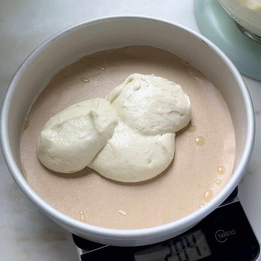 Key lime cake batter added to prepared cake pan.