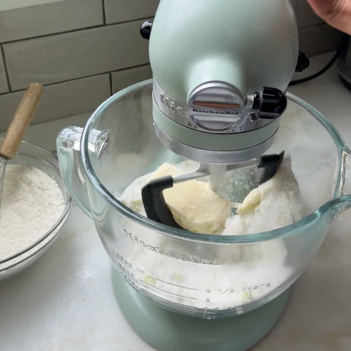 Creaming the sugar and butter in a stand up mixer for the batter.