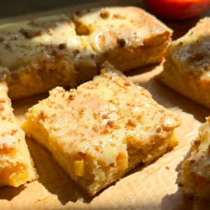 Close up of Peach Cobbler Brownies on cutting board.