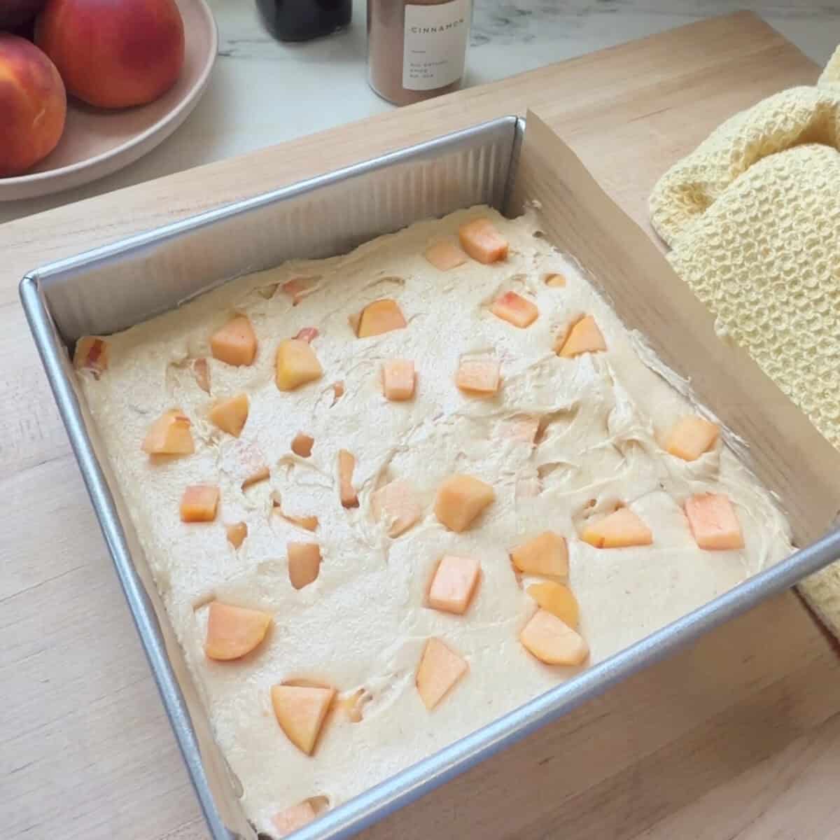 Peach Cobbler Brownie batter in baking pan.