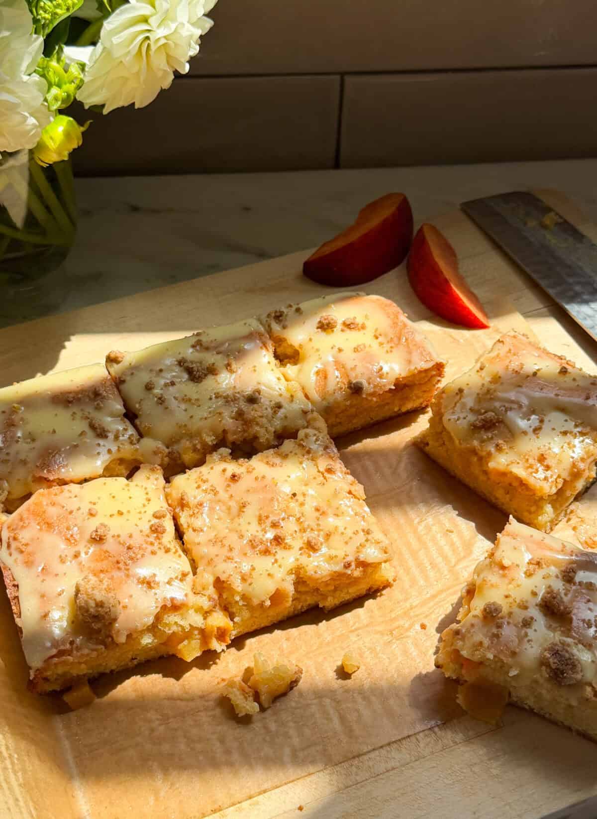 Sliced Peach Cobbler Brownies on cutting board.