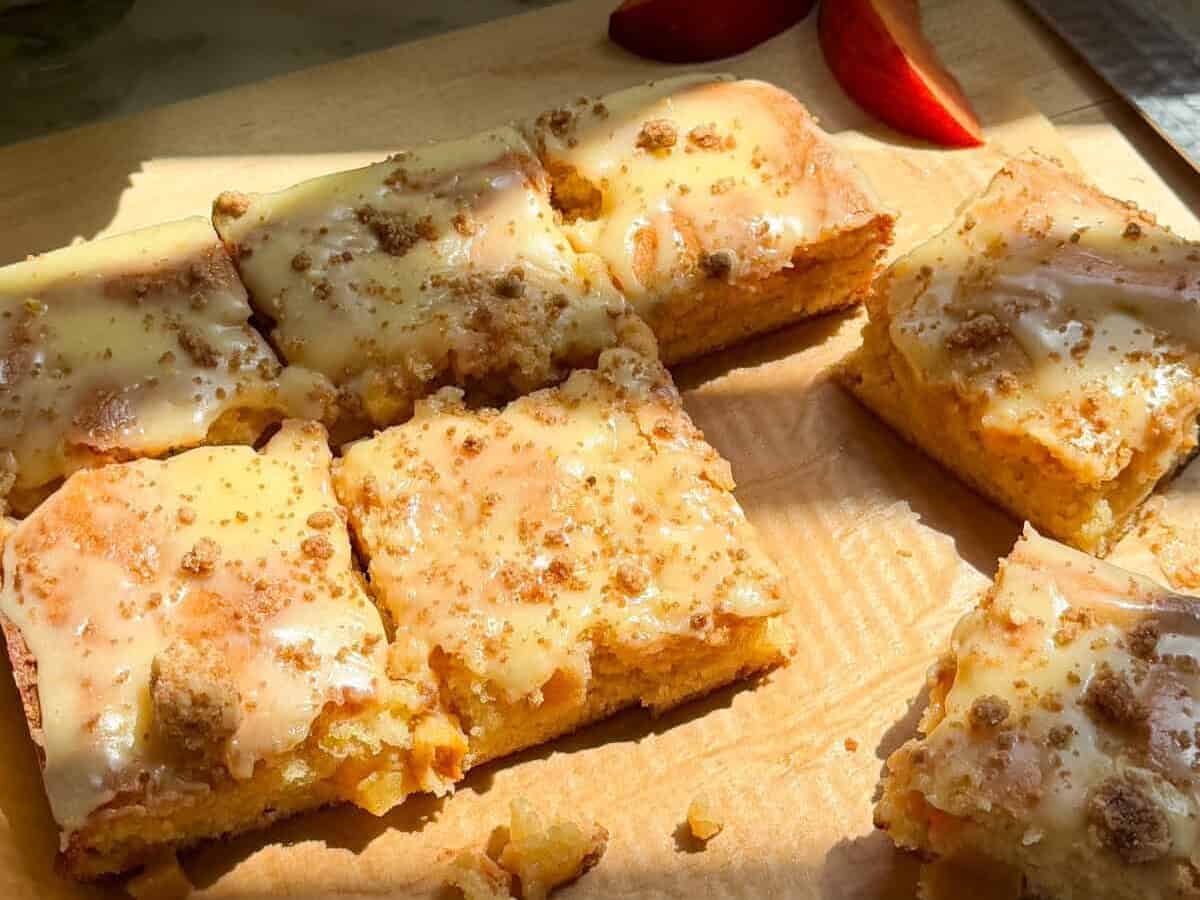 Sliced Peach Cobbler Brownies on cutting board.