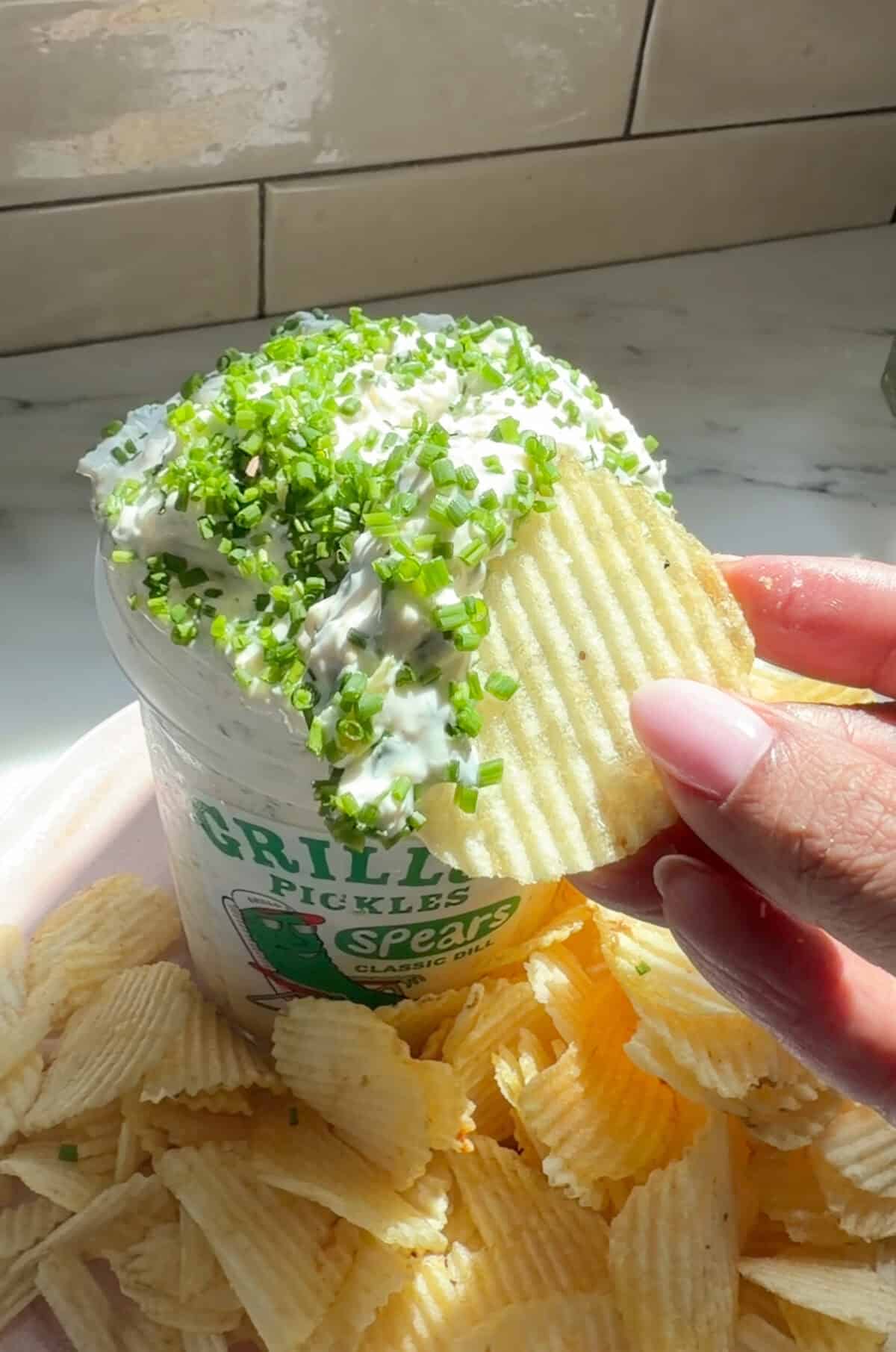 Pickle dip on a ruffle chip.