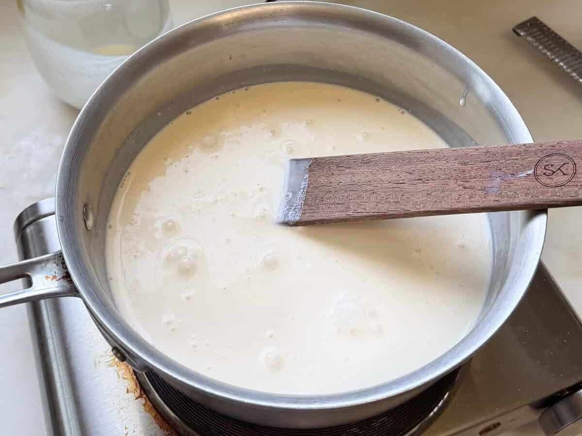 Milk, cream, and sugar mixture in a pot.