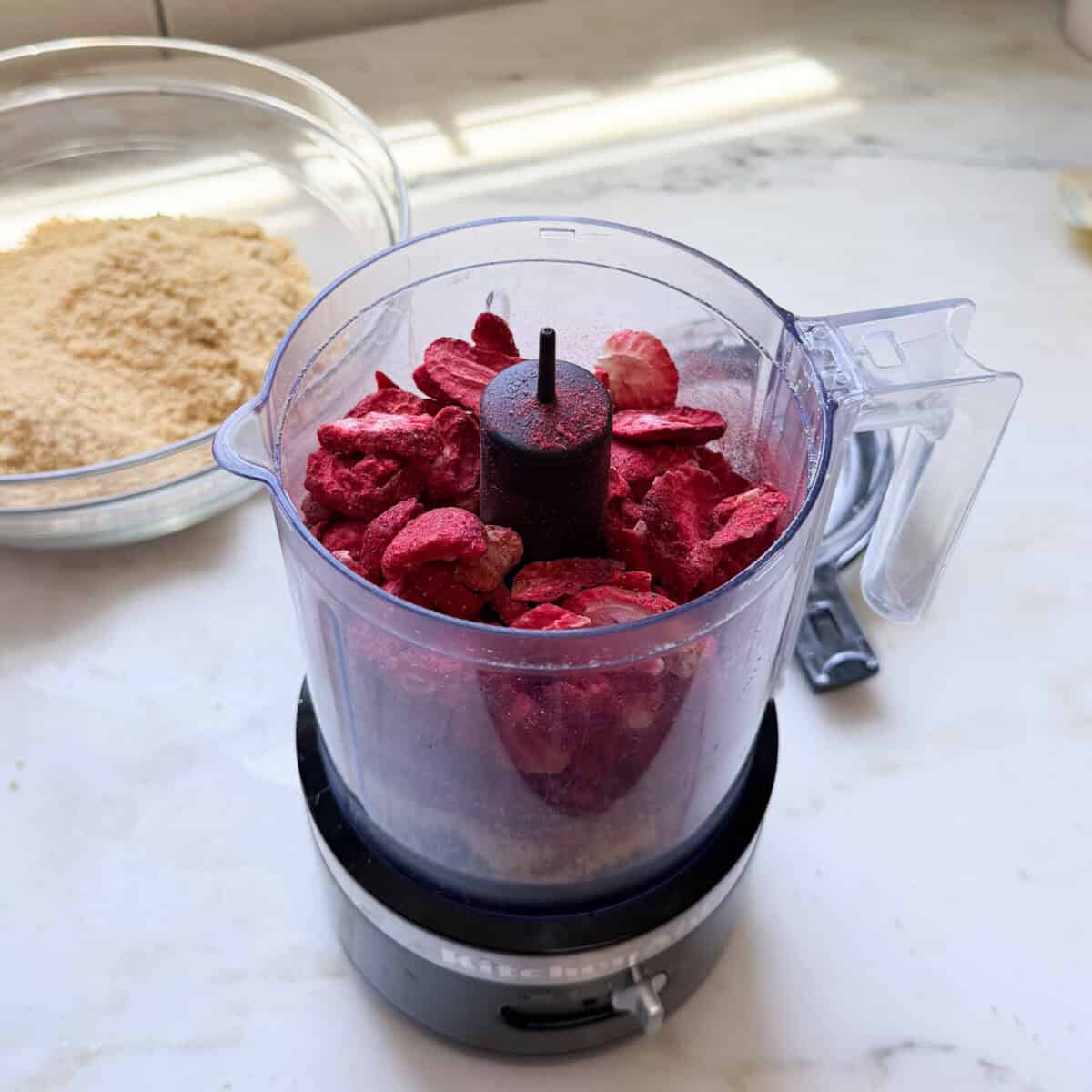 Freeze dried strawberries in food processor.