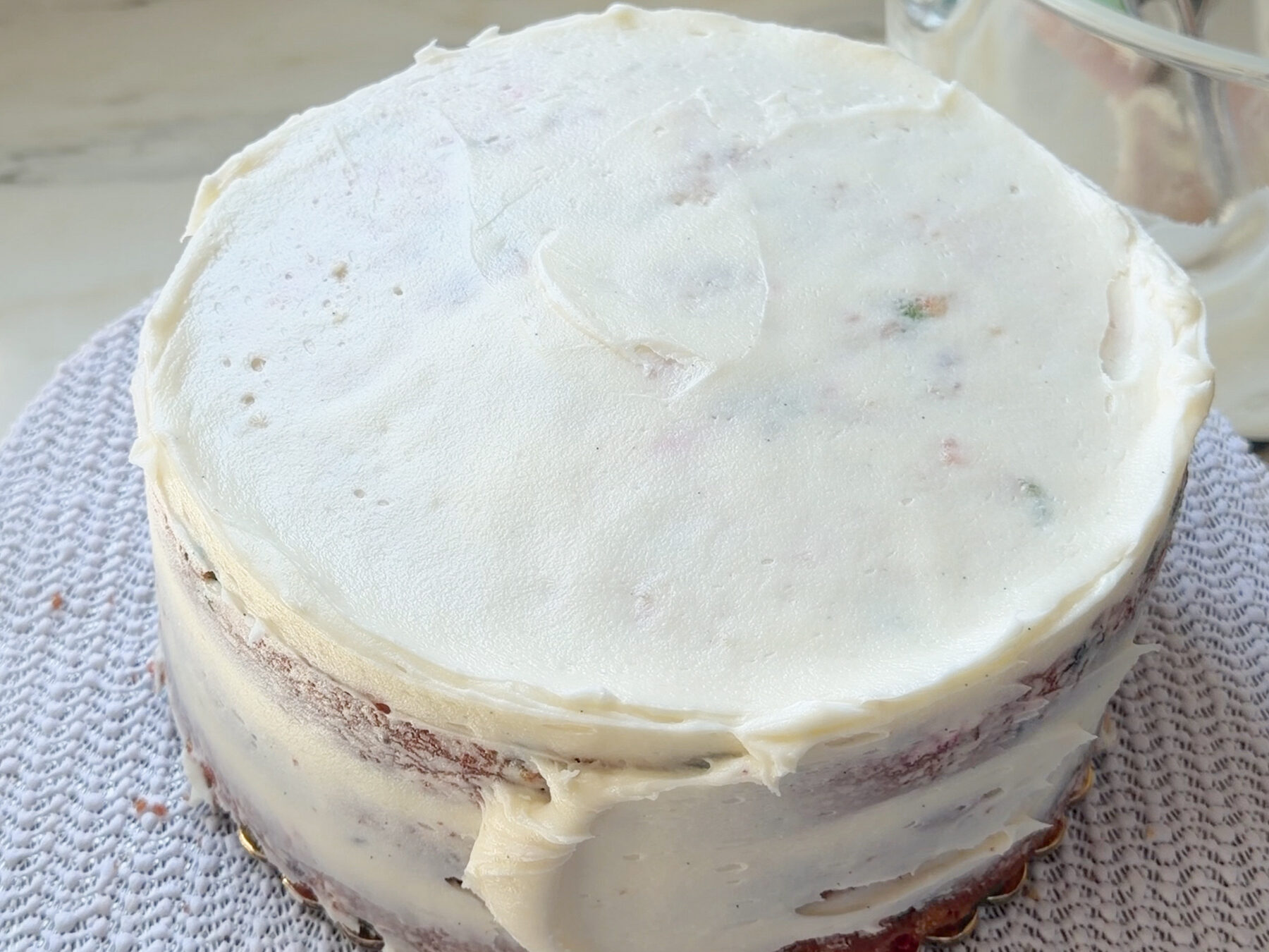 Crumb coat on funfetti cake.