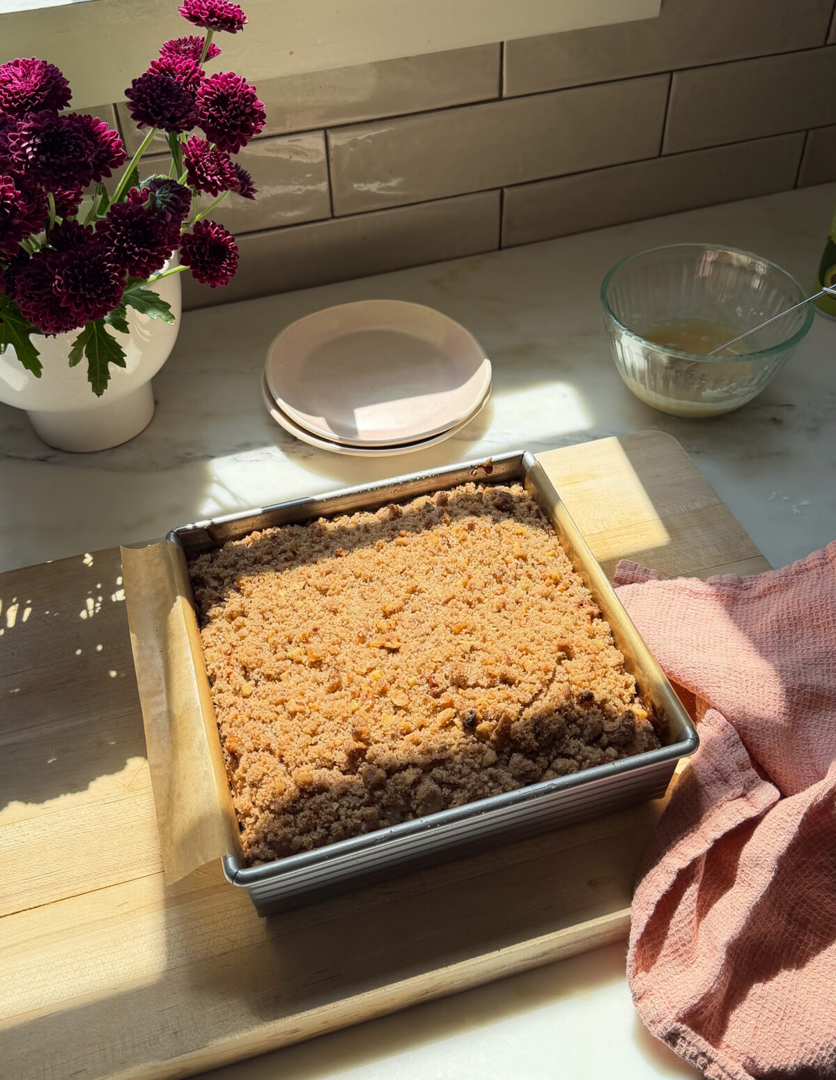 Freshly baked banana bread coffee cake in baking pan.