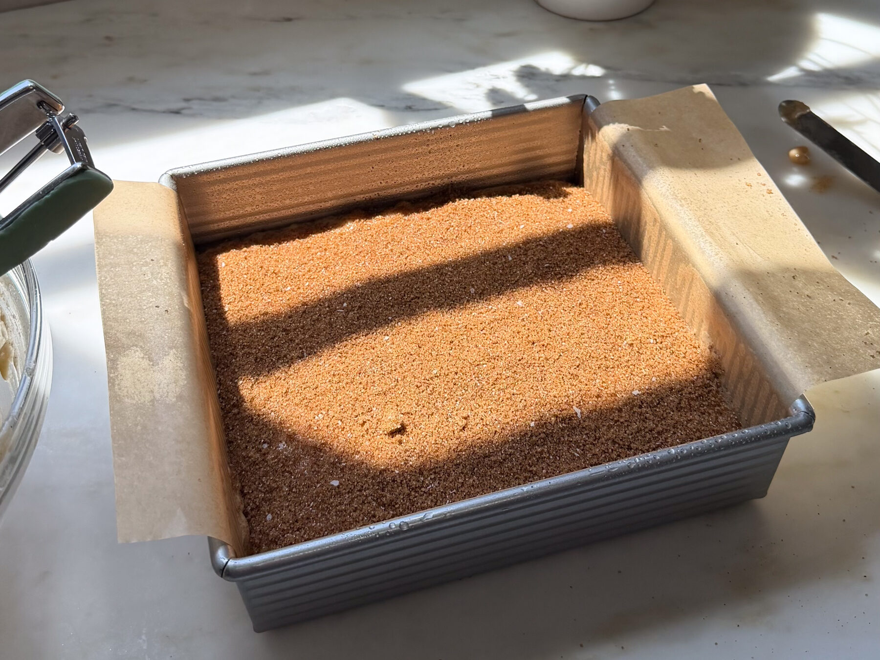 Espresso filling layered on top of banana bread coffee cake batter in baking pan.
