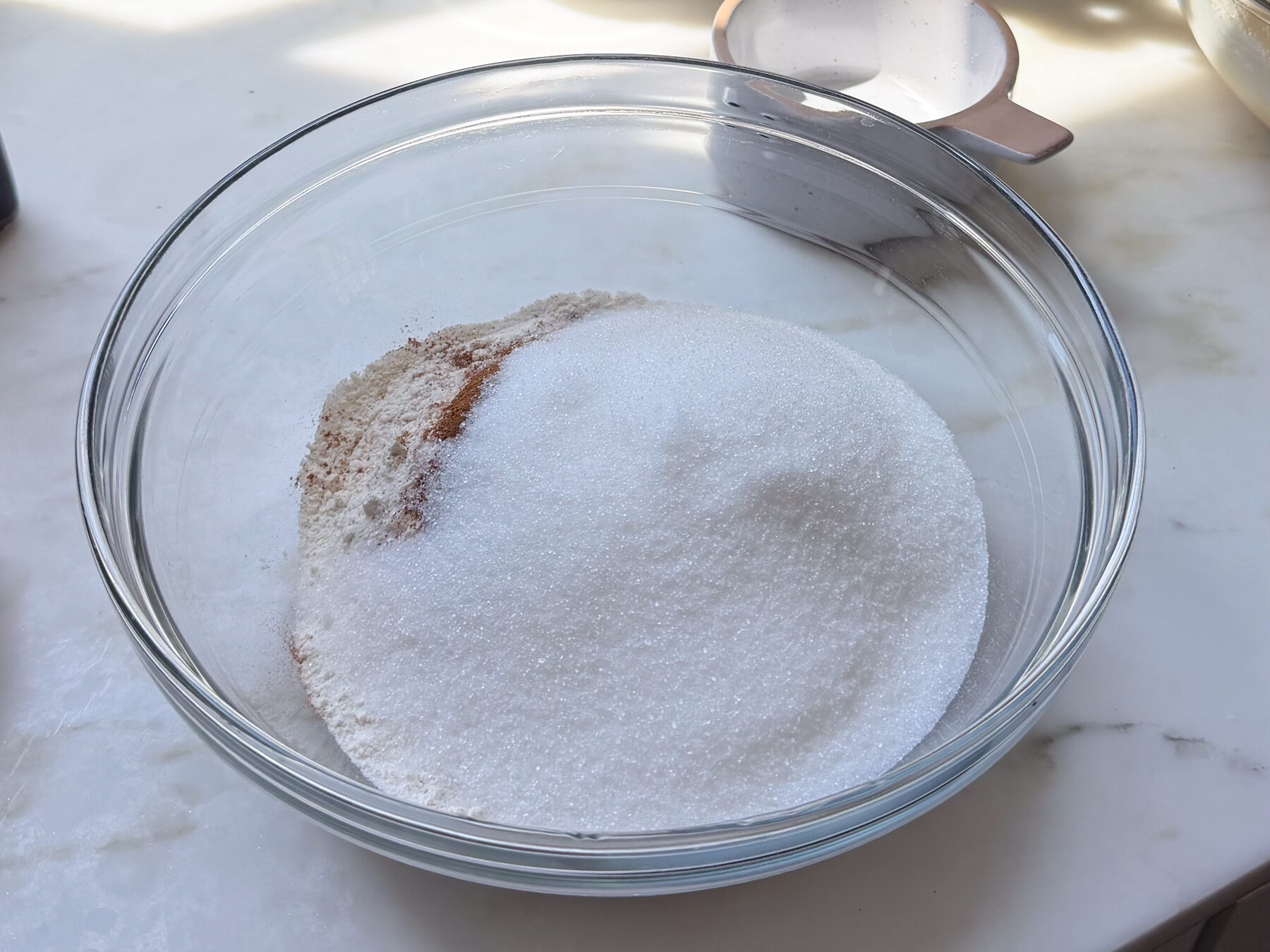 Banana bread coffee cake dry ingredients in large bowl.