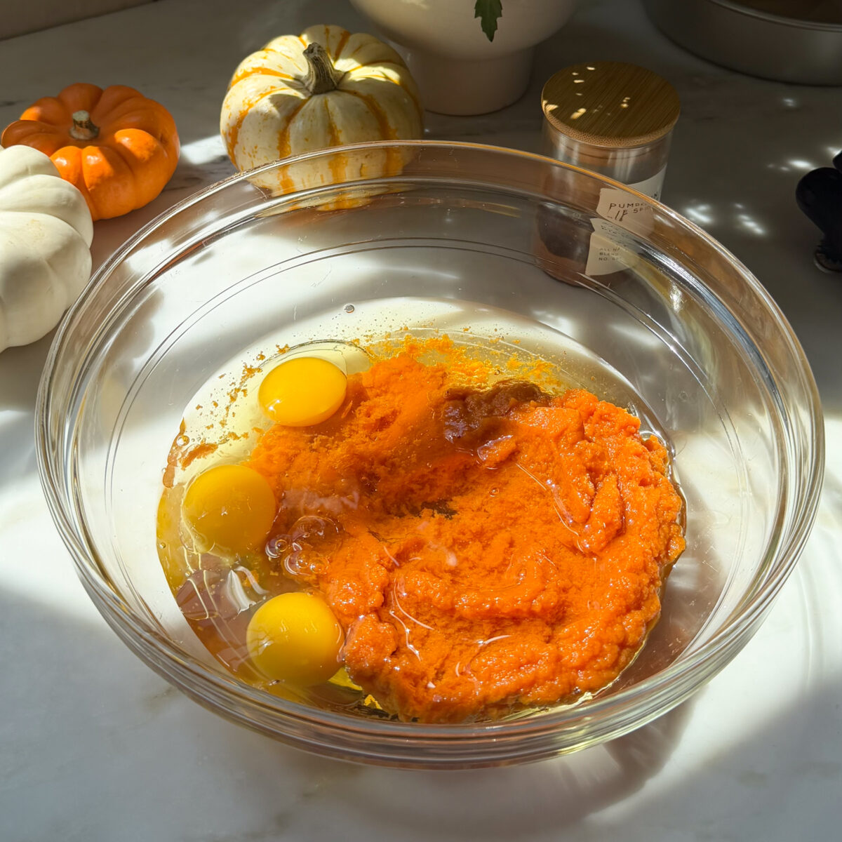 Pumpkin cake wet ingredients in large bowl.