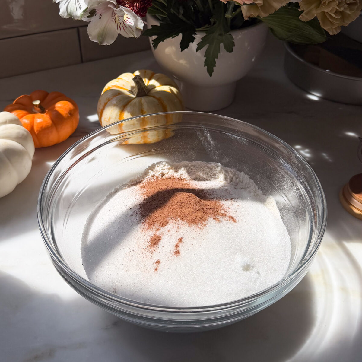 Pumpkin cake dry ingredients in bowl.