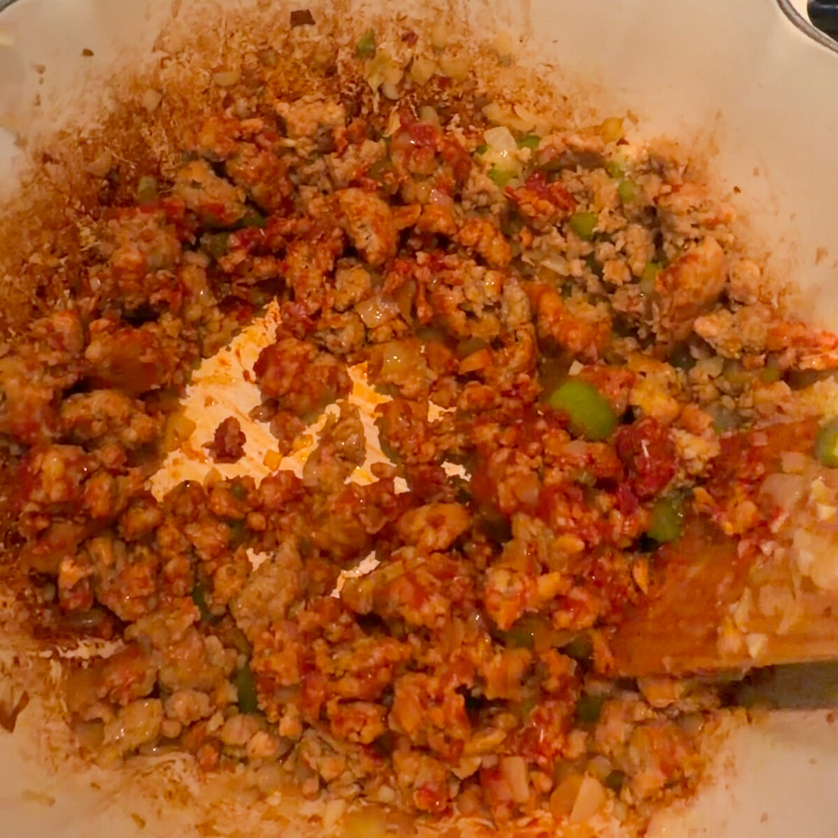 Sausage sauteed with aromatics, spices, and tomato paste.